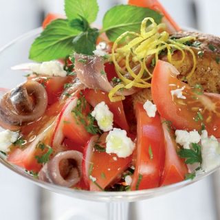 Summer salad with Tomatoes, barley rusks, Feta, Anchovies and Herbs