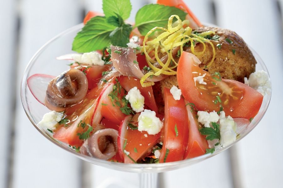 Summer salad with Tomatoes, barley rusks, Feta, Anchovies and Herbs